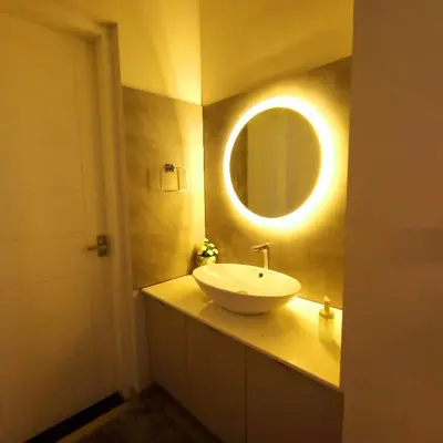 a bathroom with a sink and a mirror on the wall at Wayanad Empire Colonial Villa in Kalpetta