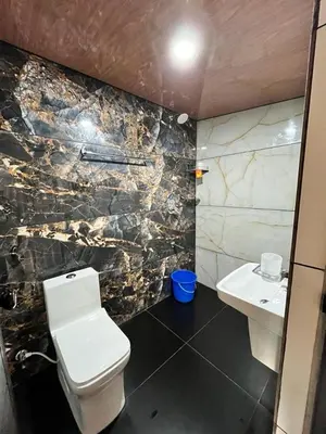 a bathroom with a toilet and a sink at Springfield service villa in Mananthavady