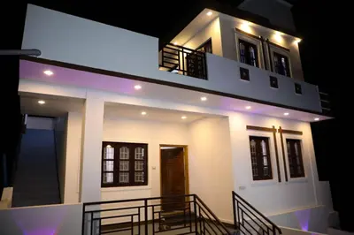 a house with a staircase leading up to it at JDP Villa 2 Bhk House in Ooty