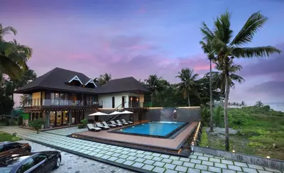 an image of a house with a swimming pool at Maliekal Heritance Cherai Beach Cochin in Cherai Beach