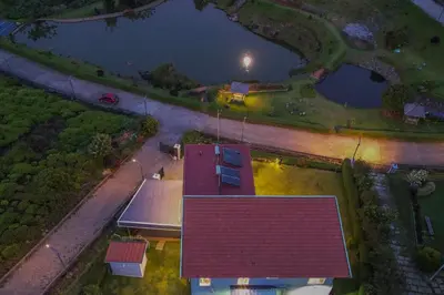 an overhead view of a house with a red roof at Kalpavriksha 4BR Luxury Villa - Xplore Indo in Kotagiri