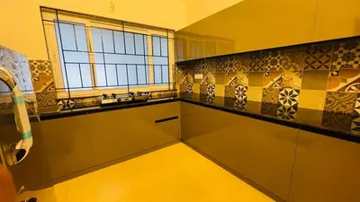 a kitchen with a sink and a window at Seagrove Villa in Kappad