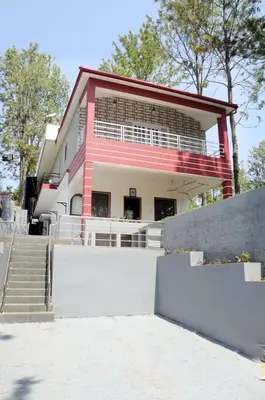 a large building with stairs in front of it at Franc Villa - Kothagiri in Kotagiri