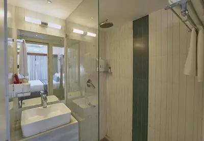 a bathroom with a sink and a shower at Noah Sky Suites in Cochin