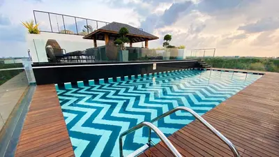 a swimming pool on top of a house at Noah Sky Suites in Cochin
