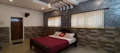 a bedroom with a bed in a room at Spice Garden Farm house in Sultan Bathery