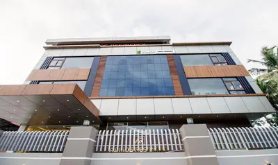 a tall building with a lot of windows at Treebo Amigos Residency in Cochin