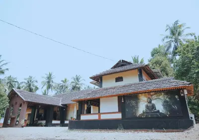 a building with a mural in front of it at Vintage Vista in Lakkidi