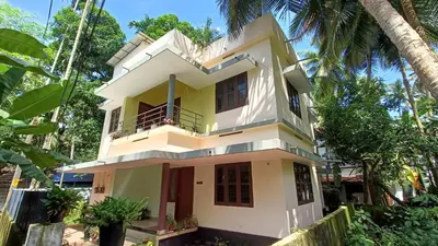a house in the middle of a forest at Pebbles in Kozhikode