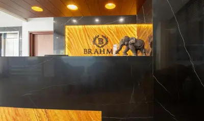 a exhibit with an elephant statue in a room at Treebo Brahma, Wayanad in Sultan Bathery