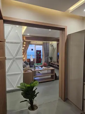 a room with a living room with a couch at Ivory sea castle in Kozhikode