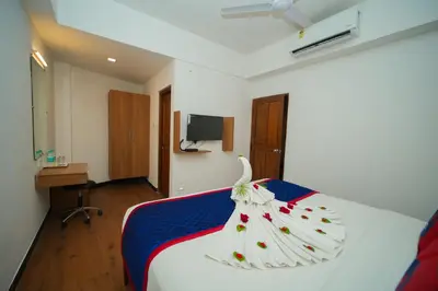 a hotel room with a bed with a towel on it at Zip by Spree Hotels Mangala International in Coimbatore