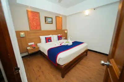 a bedroom with a large bed with a swan on it at Zip by Spree Hotels Mangala International in Coimbatore