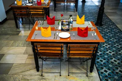 a table with colorful napkins on top of it at Zip by Spree Hotels Mangala International in Coimbatore