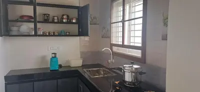 a kitchen with a sink and a counter top at SHI's Peaceful Oasis near Isha Adiyogi, Kovai Kuttralam Waterfalls & Karunya University in Alāndurai