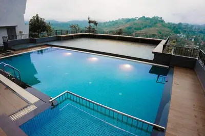 a large swimming pool on top of a building at Leaves Resort Vythiri Wayanad in Vythiri