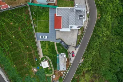 an overhead view of a house with a road at AVJ Nest, Kodaikanal in Kodaikānāl