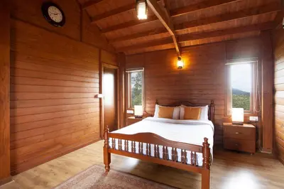 a bedroom with a bed in a wooden room at StayVista at Little Heaven with Breakfast in Ooty