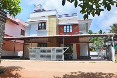 a house with a gate in front of it at DREAMS VILLA Near Rajagiri Hospital in Alwaye