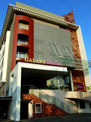 a building with a casino broker sign on it at Paravoor Galaxy Hotel in Cherai Beach