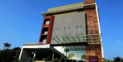 a building with a sign on the front of it at Paravoor Galaxy Hotel in Cherai Beach