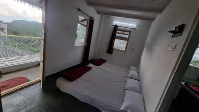 a bedroom with a bed in a room with a window at Sandiago Villa 2 Bhk House in Ooty