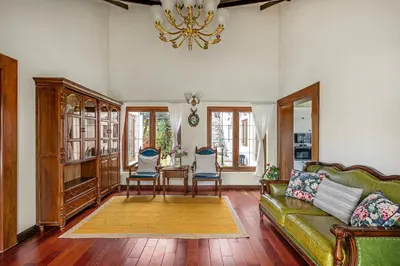 a living room with a couch and a table and chairs at The Winterfel in Yedapalli