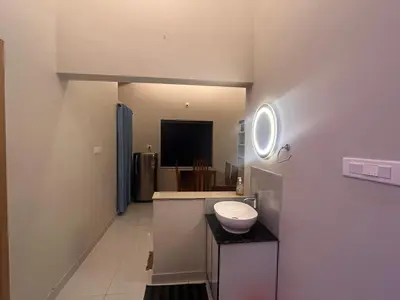 a bathroom with a sink on a counter and a sink at Chaithanya Residency Near to NIT Kozhikode in Kunnamangalam