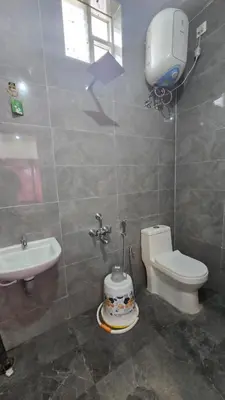 a bathroom with a toilet and a sink at Sandy Castle Villa 3 Bhk Homestay in Ooty