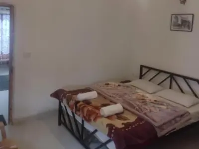 a bedroom with a bed with two pillows on it at Misty Moonrise in Kūkkāl