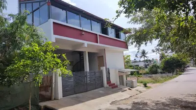 a house on the side of a street at Karimbummel House- A room with spacious Balcony in Mysore