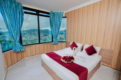 a bedroom with a bed with a swan on it at Tulips Resorts - Elkhill in Ooty