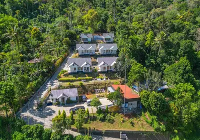 an aerial view of a house in the forest at Munnar Majestic Resort with Pool in Munnar