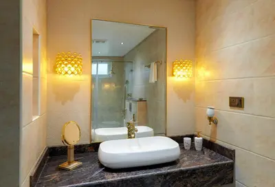 a bathroom with a sink and a shower and a tub at Clouds Nest By Aanvis Inn in Ooty