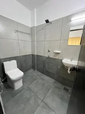 a bathroom with a toilet and a sink at Furnished 2 BHK Family Apartments near Triprayar Shree Rama Temple - Beevees Homes Thriprayar in Thanniyam