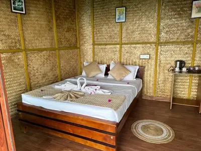 a bedroom with a bed in a room at Qatsyir Horizon in Varagampadi