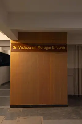 a sign that reads st vaughan migrant exchange on a wooden door at Fortune Inn in Erode