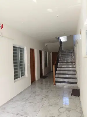 an empty hallway with stairs in a house at Shams al Imarat in Palakkad