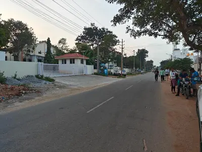a group of people walking down a street at 2Bhk holiday home in Mysore