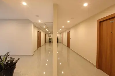 a corridor of an office building with a hallway at HOTEL PRINCE in Kāladi