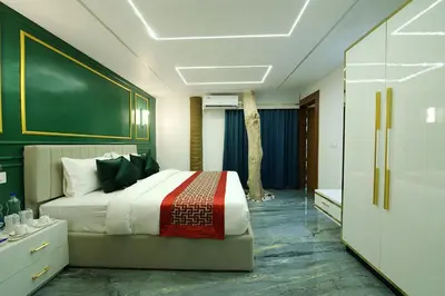a bedroom with a bed and a green wall at Mystery Maze Resort and Spa in Wayanad