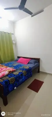 a bedroom with a bed and a ceiling at Hiya Holidays in Munnar