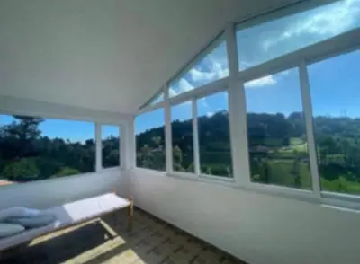 a white room with windows and a bench in it at White House Kotagiri, 2bhk in Kotagiri