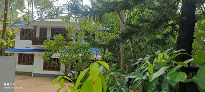 a house in the middle of a forest at Vyshnavi home stay in Thanniyam