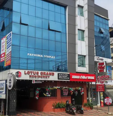 a store front of a building in a city at Lotus Grand Residency in Angādipuram