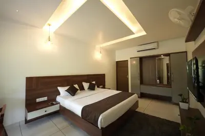 a bedroom with a large bed in a room at jungle view resort in Mananthavady