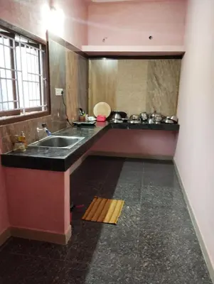 a kitchen with a sink and a counter top at SHI Triveni 1BHK at Coimbatore Outskirts in Irugūr