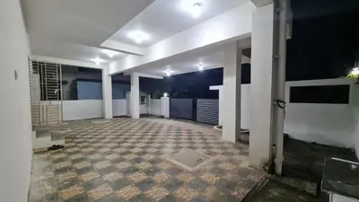 an empty hallway of a house at night at Kamalam 3BHK Villa 1AC and 2 Non AC Bedrooms in Coimbatore
