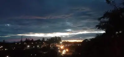 a view of a city at night at Stay awhile in Ooty