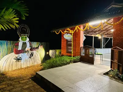 a room with a statue of a person on a skateboard at Farm Fort Resort in Kozhikode